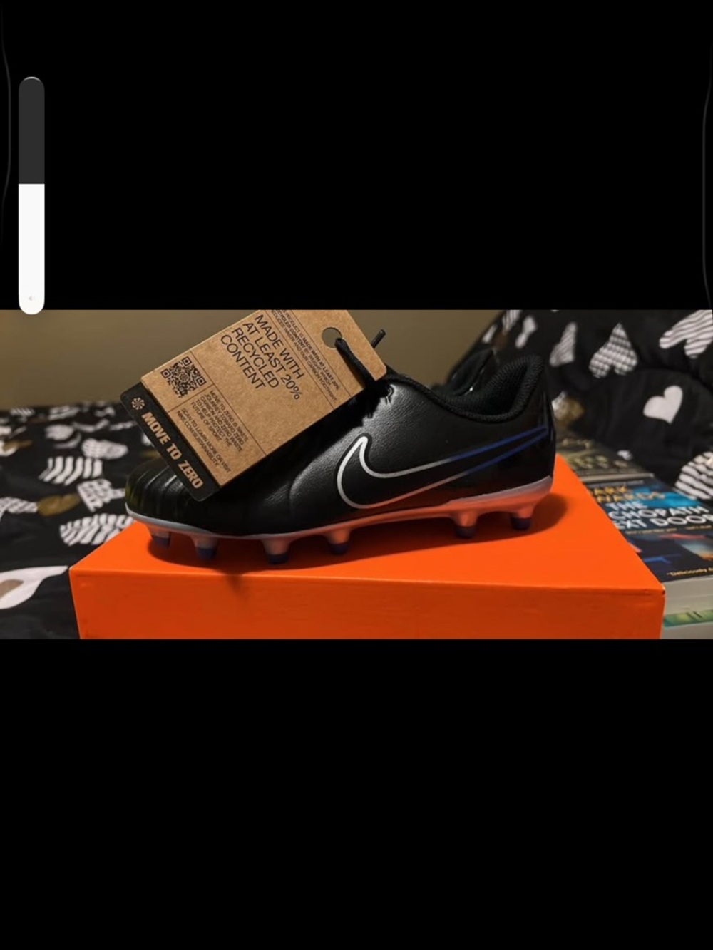 JR Legend 10 Club Nike Black Soccer Cleats with Orange Sole and Blue Accent